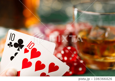 Cards, playing chips and alcohol in glass 106366826