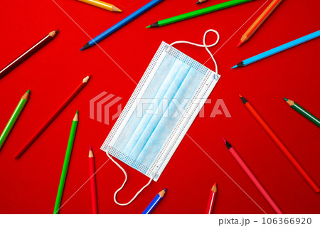 Colorful pencils and medical face mask. Pandemic education concept 106366920