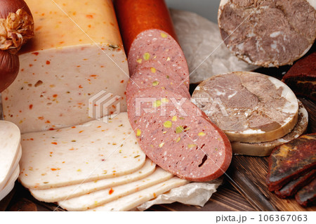 Variety of meat and sausage products on table 106367063