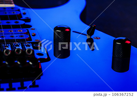 Electric guitar body in the dark close up Electric guitar body in the dark close up 106367252