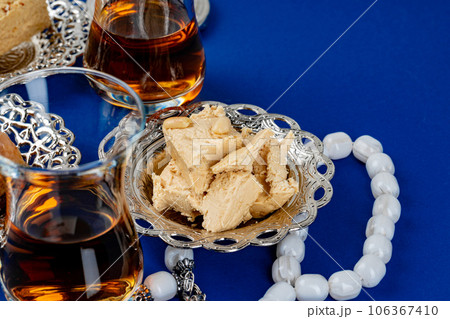 Halva dessert with tea cup on blue background 106367410