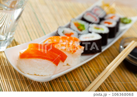 Various of nigiri and hosomaki sushi traditionally served with wasabi and soy sauce Various of nigiri and hosomaki sushi traditionally served with wasabi and soy sauce 106368068