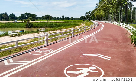 red footpath and bike path for people to exercise red footpath and bike path for people to exercise 106371151