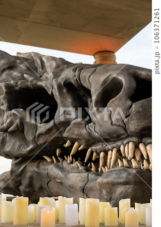 Bones and sword skull dragon defeated with candles. Concept of Halloween Death day sacrifice ritual. Bone of head mammal. House of the Dragon series 106371261