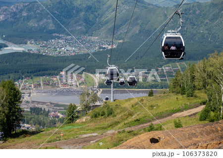 Close-up of a cable car cabin against the sky. Cable car trip to viewpoints in the mountains. During the trip by cable car Tourists enjoy beautiful views and experience exciting. 106373820