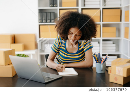 Small business entrepreneur SME freelance African woman working at home office, BOX,tablet and laptop online, marketing, packaging, delivery, e-commerce concept Small business entrepreneur SME freelance African woman working at home office, BOX,tablet and laptop online, marketing, packaging, delivery, e-commerce concept 106377679