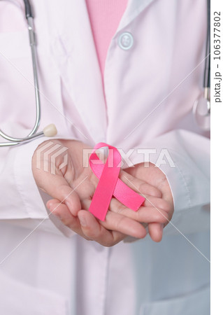 Pink October Breast Cancer Awareness month, doctor with pink Ribbon in hospital for support people life and illness. National cancer survivors month, Mother and World cancer day concept Pink October Breast Cancer Awareness month, doctor with pink Ribbon in hospital for support people life and illness. National cancer survivors month, Mother and World cancer day concept 106377802
