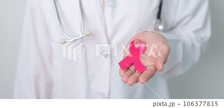 Pink October Breast Cancer Awareness month, doctor with pink Ribbon in hospital for support people life and illness. National cancer survivors month, Mother and World cancer day concept Pink October Breast Cancer Awareness month, doctor with pink Ribbon in hospital for support people life and illness. National cancer survivors month, Mother and World cancer day concept 106377815