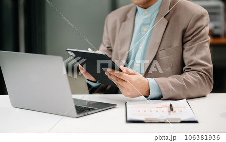 Businessman s hands typing on smartphone, tablet and laptop keyboard computer, typing, online in office. 106381936