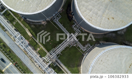 Aerial view liquid chemical tank terminal, Storage of liquid chemical and petrochemical products tank, Oil and gas storage tanks at industrial oil refinery. Aerial view liquid chemical tank terminal, Storage of liquid chemical and petrochemical products tank, Oil and gas storage tanks at industrial oil refinery. 106382933
