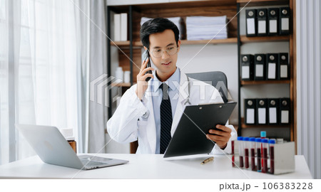 Man doctor phone call, healthcare talking and medical service writing sick note, surgery planning and prescription.and clinical report test results in office 106383228