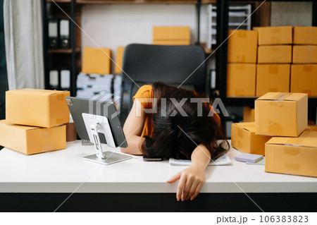 Overworked young Asian businesswoman office worker suffering from neck pain after had a long day at office desk. office syndrome concept Overworked young Asian businesswoman office worker suffering from neck pain after had a long day at office desk. office syndrome concept 106383823