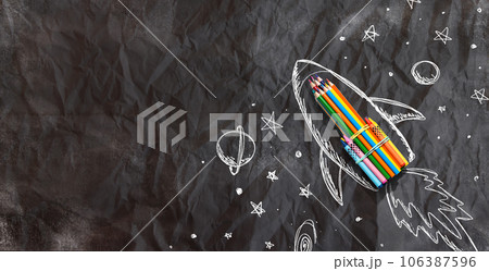 Back to school theme with hand drawn rocket and colored pencils Back to school theme with hand drawn rocket and colored pencils 106387596