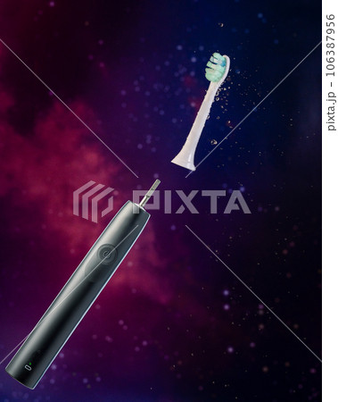 Electric toothbrush against the background of the starry sky, splashes of water. close-up. Electric toothbrush against the background of the starry sky, splashes of water. close-up. 106387956
