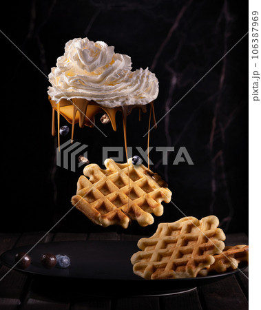 Viennese waffles and cream in the form of a cloud. chocolate rain Viennese waffles and cream in the form of a cloud. chocolate rain 106387969