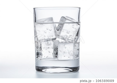 Glass with pure water and ice on a white background Glass with pure water and ice on a white background 106389089