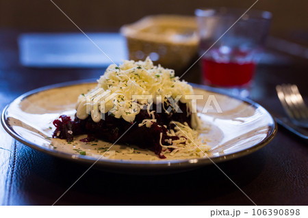 Mix of beets, cheese, mayonnaise on a plate in restaurant 106390898