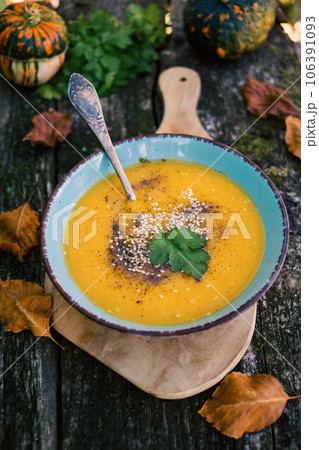 pumpkin soup on wooden table autumn dish pumpkin soup on wooden table autumn dish 106391093