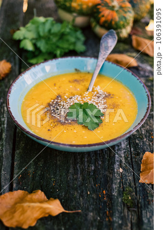 pumpkin soup on wooden table autumn dish pumpkin soup on wooden table autumn dish 106391095