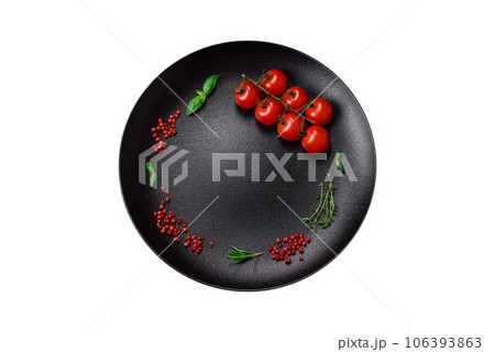 Ingredients for cooking cherry tomatoes, salt, spices and herbs Ingredients for cooking cherry tomatoes, salt, spices and herbs 106393863