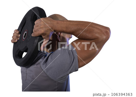 man works with balance disc at the gym man works with balance disc at the gym 106394363
