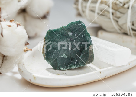 Uncut Green Moss Agate Gem Stone on Ceramic Tray Uncut Green Moss Agate Gem Stone on Ceramic Tray 106394385
