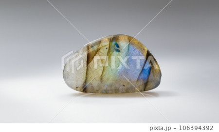 Polished Labradorite Mineral Gem Stone on Grey Polished Labradorite Mineral Gem Stone on Grey 106394392