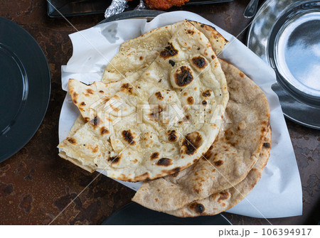 Indian Flat Bread Closeup, Traditional Flatbread also Known as Pita Bread, Roti, Chapati, Naan or Tortilla 106394917