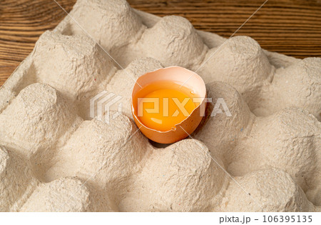 One Broken Chicken Egg, Broken Eggs in Carton Pack, Fresh Brown Hen Eggs Container 106395135