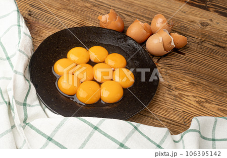 Egg Yolks in Bowl, Fresh Chicken Egg Yolk Separated from Whites for Cooking Recipe, Organic Yolks Top View Egg Yolks in Bowl, Fresh Chicken Egg Yolk Separated from Whites for Cooking Recipe, Organic Yolks Top View 106395142
