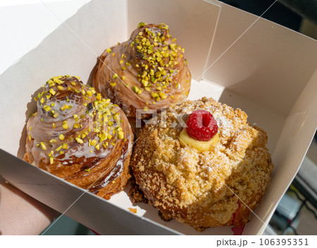 Doughnuts in Paper Box, Fruit Raspberry Donut, Pistachio Croissant Collection Doughnuts in Paper Box, Fruit Raspberry Donut, Pistachio Croissant Collection 106395351