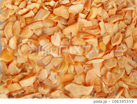 Dry Garlic Slices, Crispy Fried Cloves Pile Closeup, Roasted Grilled Garlic Flakes, Clove Chip Group Dry Garlic Slices, Crispy Fried Cloves Pile Closeup, Roasted Grilled Garlic Flakes, Clove Chip Group 106395359