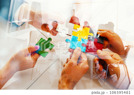 Team working background with puzzles. Double exposure effects 106395481