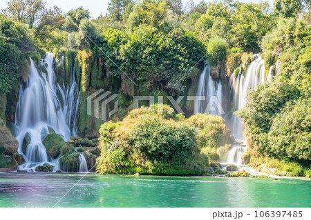 Kravica karst forest waterfall flows with lake in the foreground, Trebizat river, Bosnia and Herzegovina Kravica karst forest waterfall flows with lake in the foreground, Trebizat river, Bosnia and Herzegovina 106397485