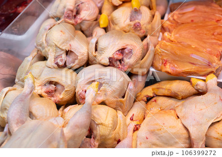 Chicken meat laid out in butcher shop window 106399272