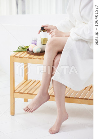 beauty concept photo of korean asain beautiful woman sitting and leaning against bath products and a bathtub 106401527