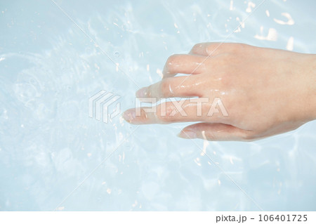 beauty concept photo of korean asain beautiful woman's hand mixing sea salt in a bathtub 106401725