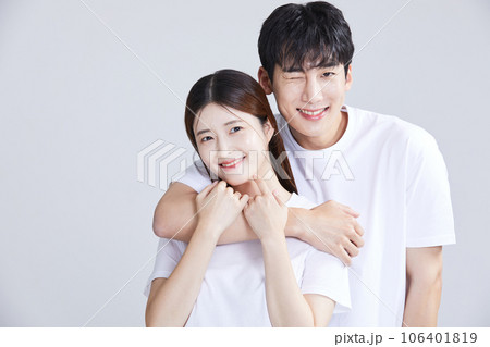 korean asian young couple embracing shoulders, wrapping shoulders around each other's shoulders korean asian young couple embracing shoulders, wrapping shoulders around each other's shoulders 106401819