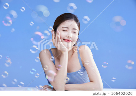 beauty concept photo of korean asain beautiful woman with soap bubbles 106402026