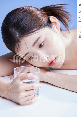 beauty concept photo of korean asain beautiful woman with a glass cup 106402110