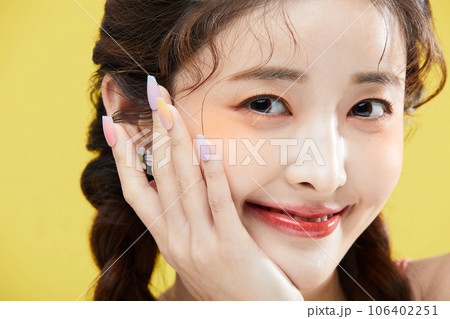 beauty concept photo of korean asain beautiful woman smiling with her chin resting on her hand beauty concept photo of korean asain beautiful woman smiling with her chin resting on her hand 106402251