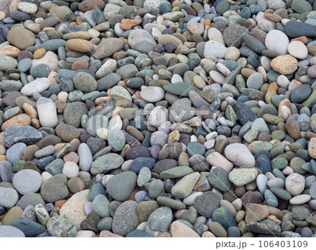 Large beach pebble. Background of small stones. Gray background from stones. Pattern. 106403109