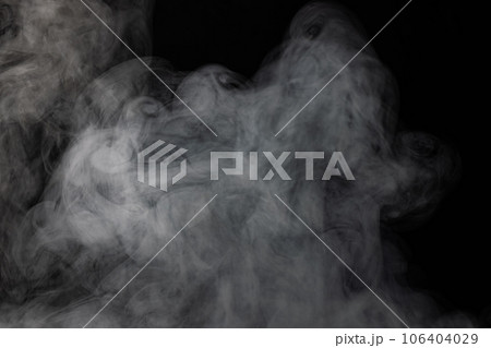 White clouds of smoke with copy space on black background 106404029