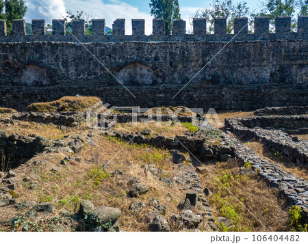 Ruin of an old castle. Remains of civilization. Fortress in Georgia.  The city of ancient stone masonry. Site of archaeological finds 106404482