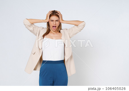 Portrait of attractive surprised excited scared screaming woman, hold hands on head, open mouth isolated over white background. Portrait of attractive surprised excited scared screaming woman, hold hands on head, open mouth isolated over white background. 106405026
