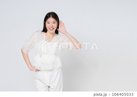 Happy young woman try to hearing you overhear listening sound to gossip looking at camera isolated on white background. Happy young woman try to hearing you overhear listening sound to gossip looking at camera isolated on white background. 106405033