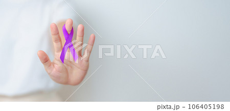 Woman holding purple Ribbon for Violence, Pancreatic, Esophageal, Testicular cancer, Alzheimer, epilepsy, lupus, Sarcoidosis and Fibromyalgia. Awareness month and World cancer day concept Woman holding purple Ribbon for Violence, Pancreatic, Esophageal, Testicular cancer, Alzheimer, epilepsy, lupus, Sarcoidosis and Fibromyalgia. Awareness month and World cancer day concept 106405198