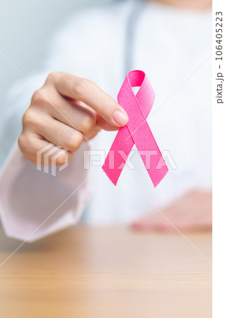 Pink October Breast Cancer Awareness month, woman doctor with pink Ribbon in hospital for support people life and illness. National cancer survivors month, Mother and World cancer day concept 106405223