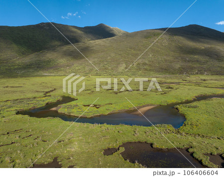 Aerial view of beautiful high altitude grassland and flowers, China Aerial view of beautiful high altitude grassland and flowers, China 106406604