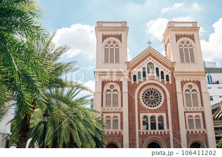 Assumption Cathedral with palm tree in Bangkok, Thailand 106411202